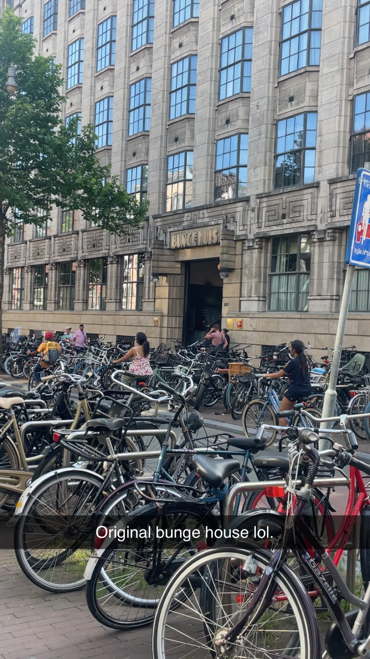 Rows of bikes parked along an Amsterdam street