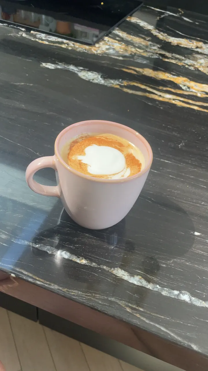A flat white on a café table in Haarlem