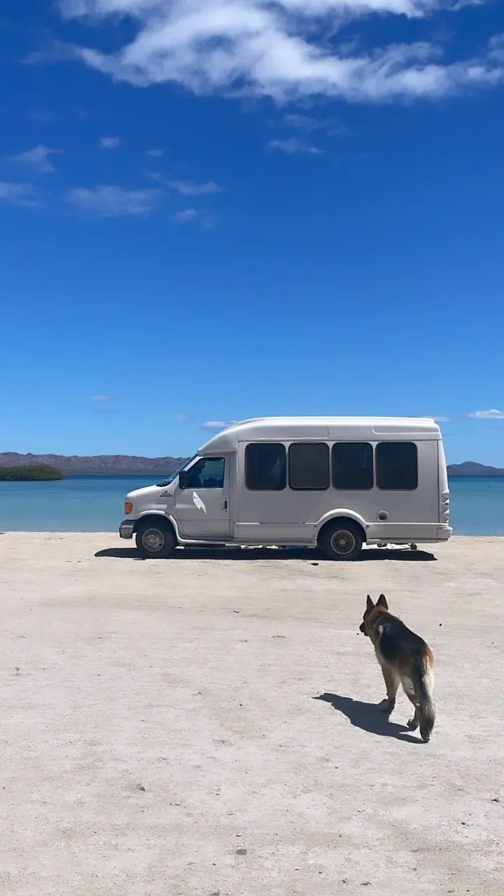 Our van parked on a white-sand beach on Bahía Concepción