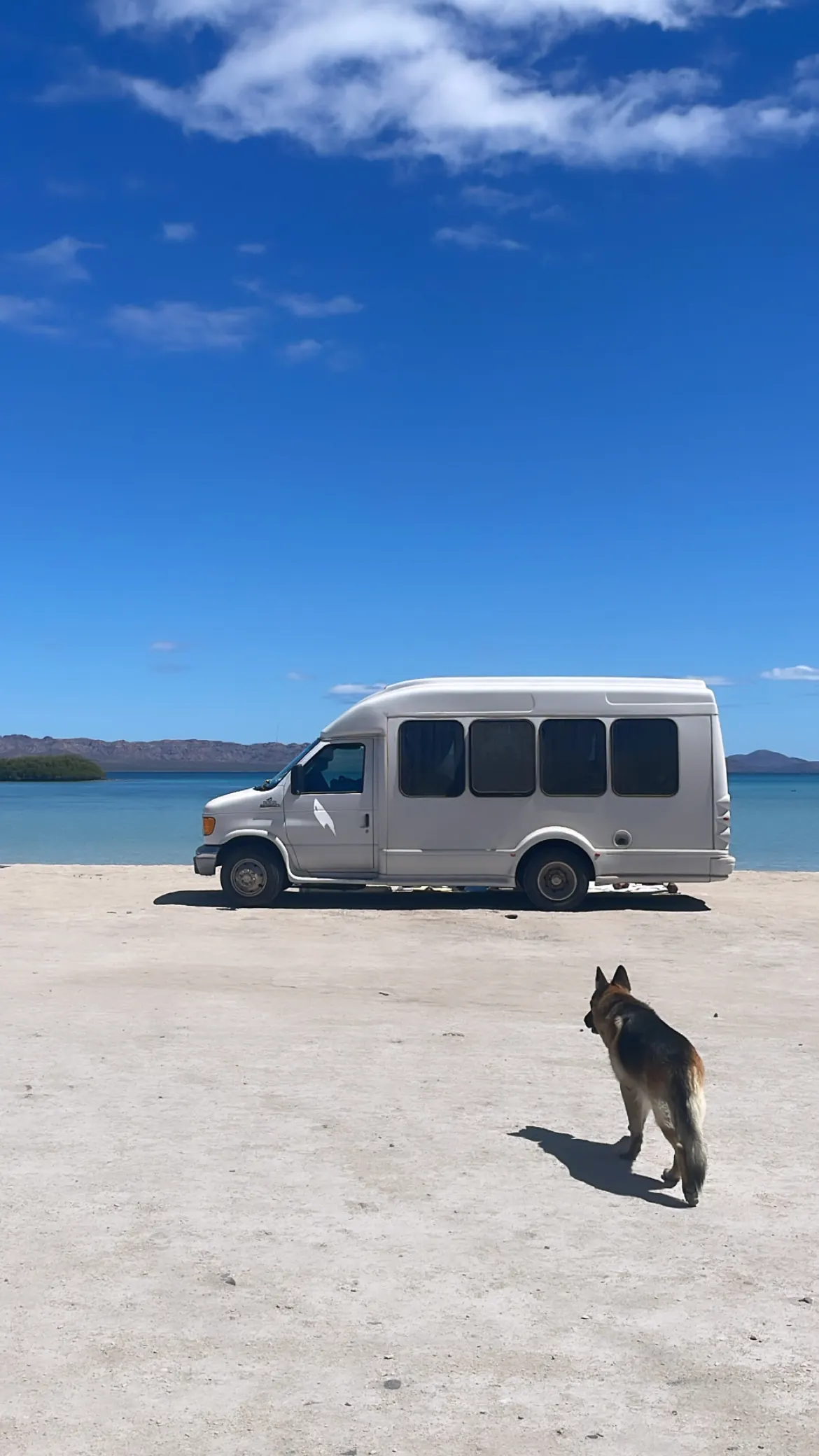 Our van parked on a white-sand beach on Bahía Concepción