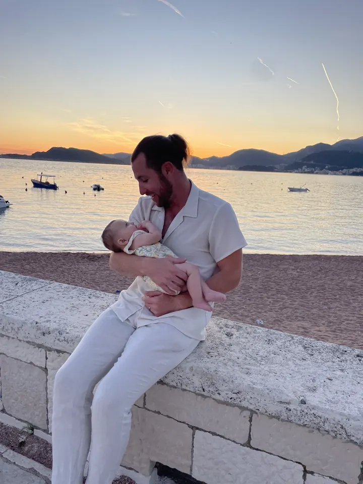 Colin holding Andi on the seawall in Budva