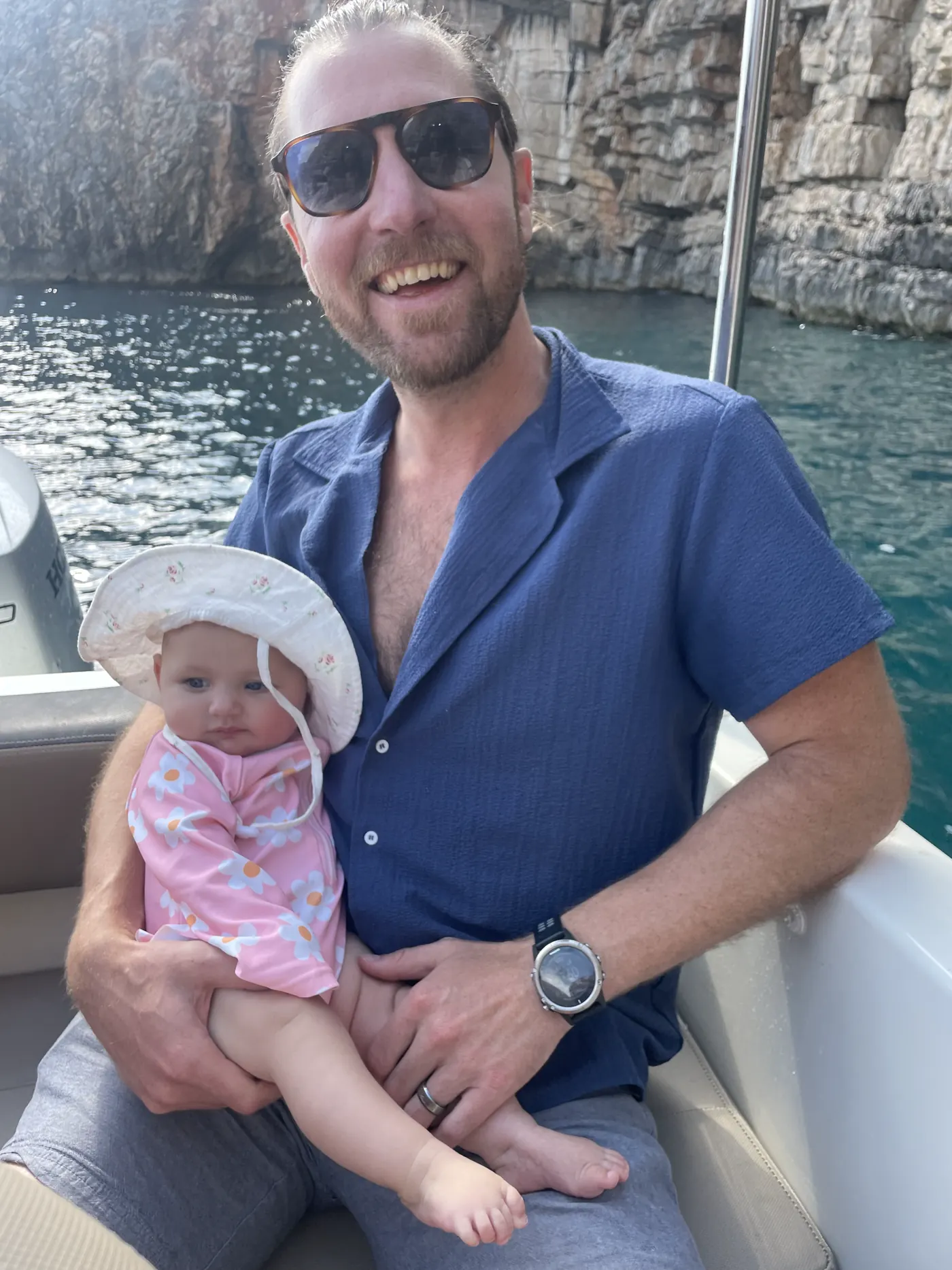 Colin and Andi in a sun hat on the boat