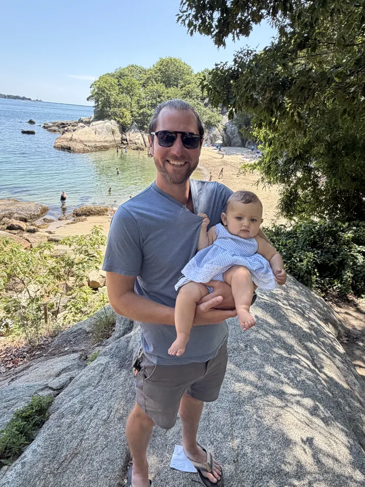 Colin holding Andi on the rocks in Gloucester