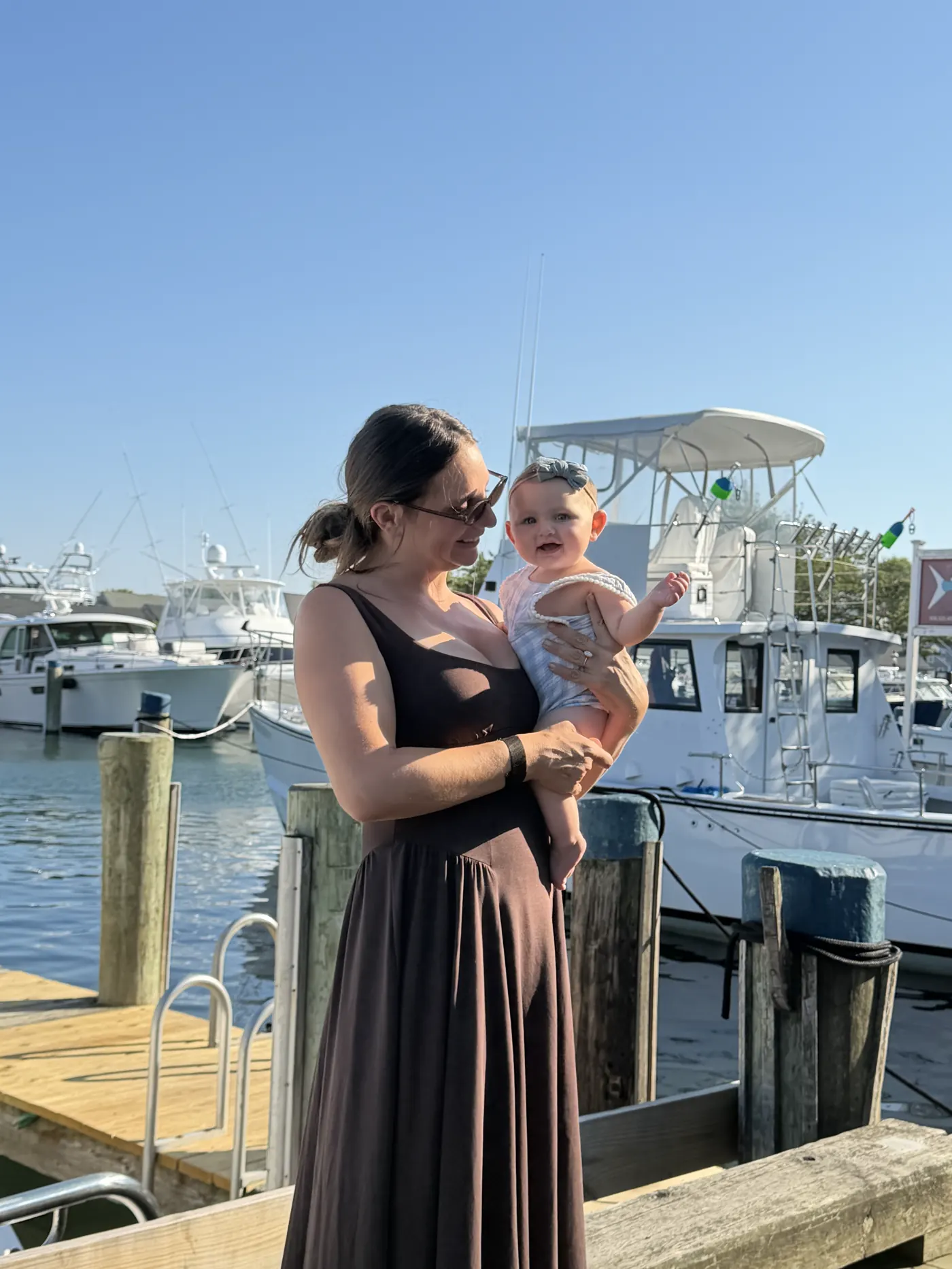 Angela holding Andi at Nantucket harbor