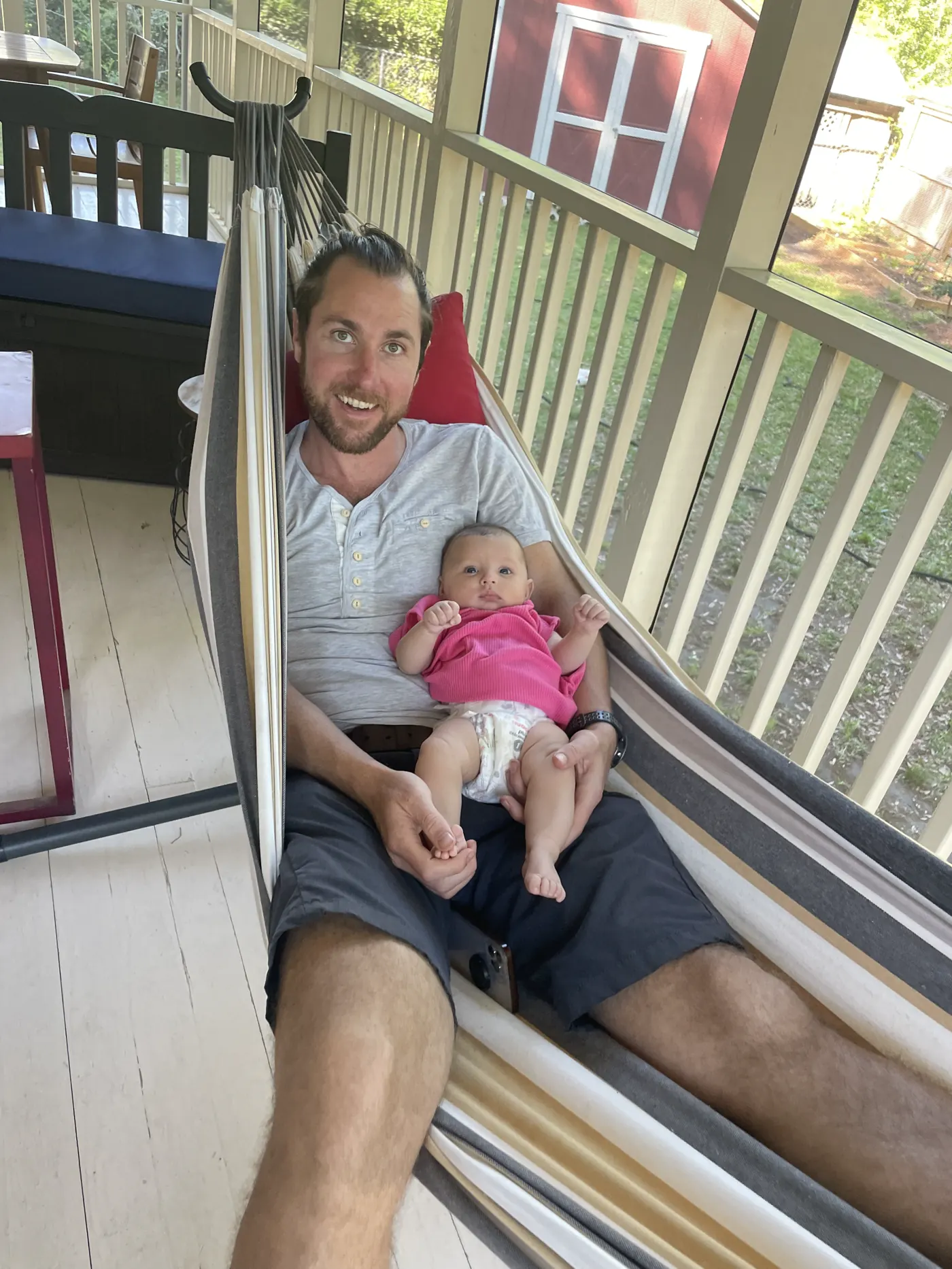 Colin and Andi in a hammock on a Charleston porch