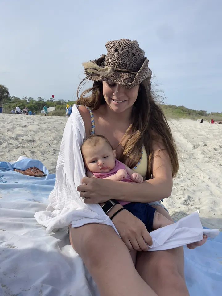 Angela holding Andi on the beach at Myrtle Beach