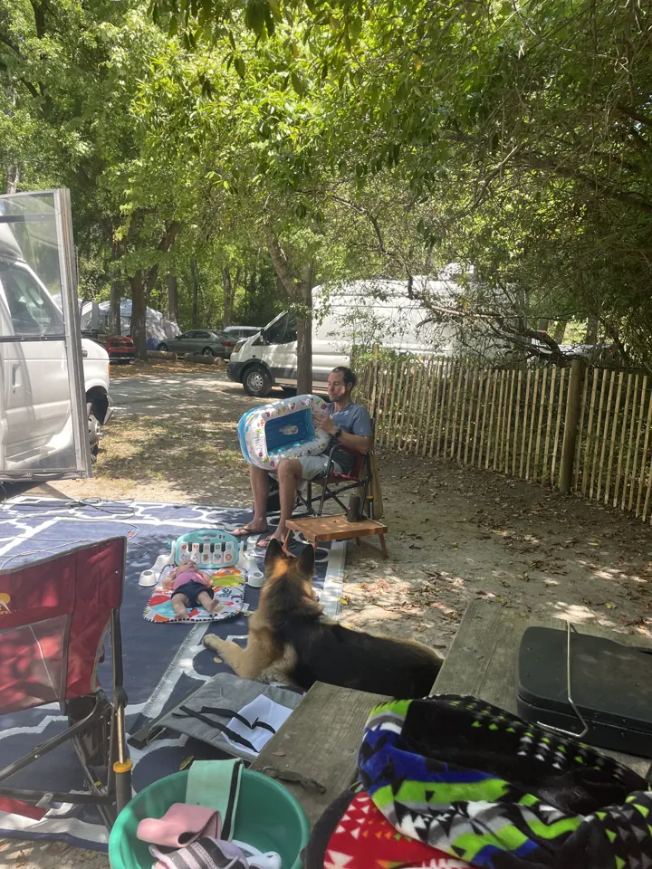 Our van campsite setup with chairs and gear