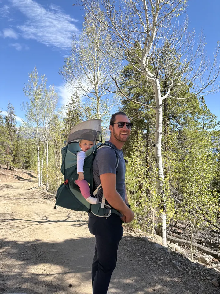 Colin with the hiking carrier in an aspen grove