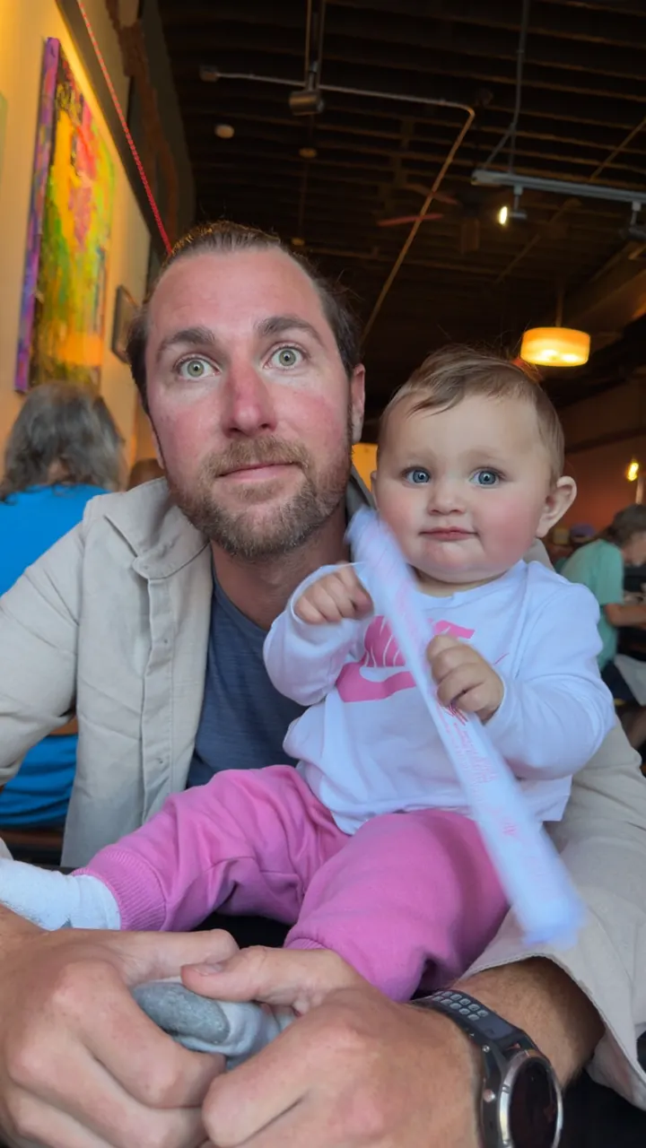 Colin and Andi at a colorful restaurant