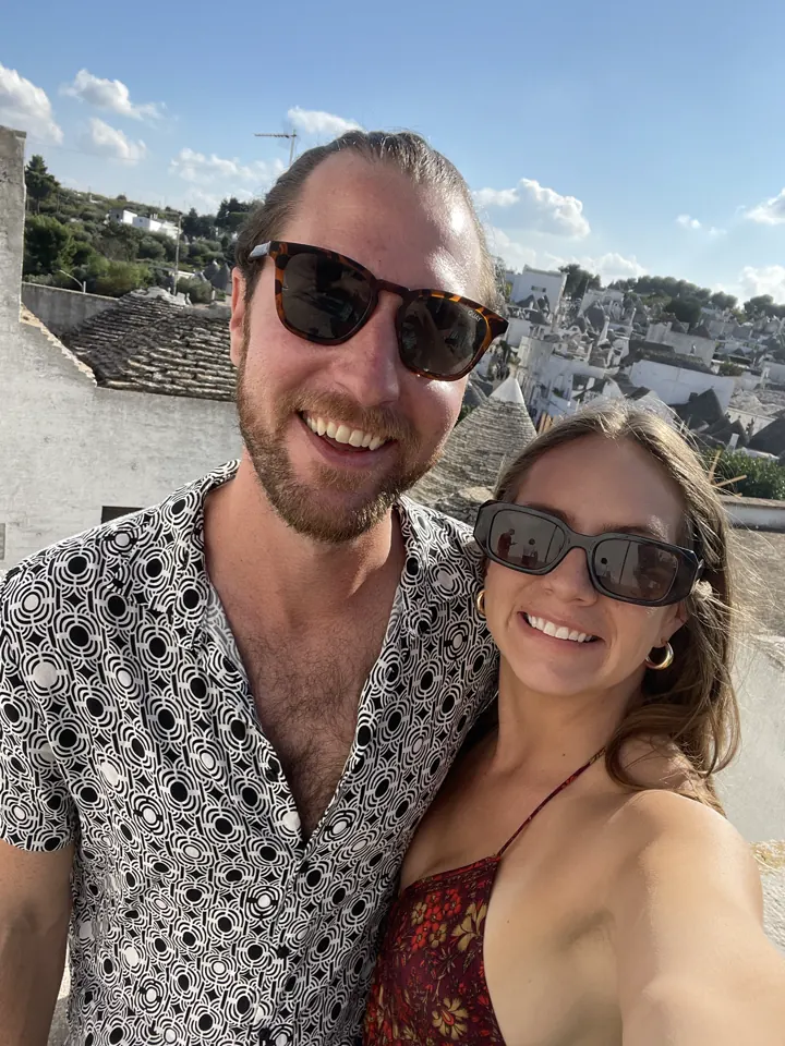 Colin and Angela in sunglasses taking a selfie in Alberobello