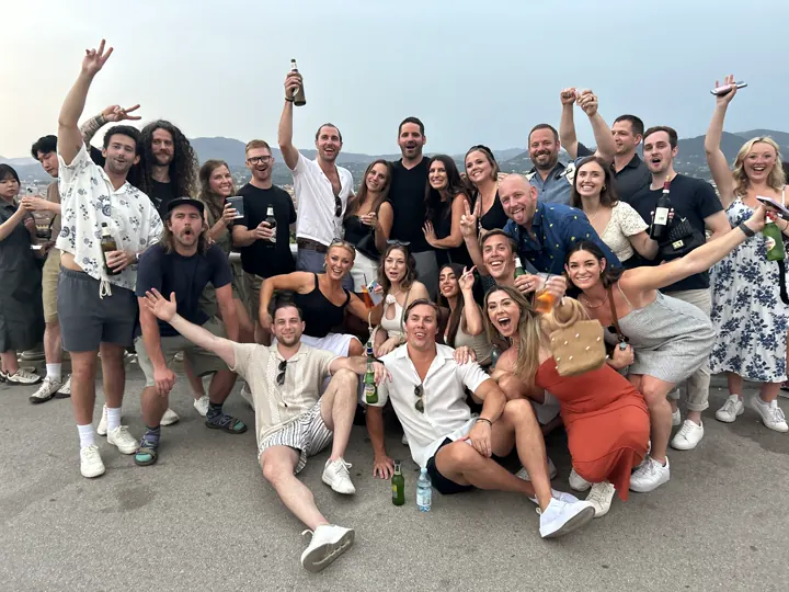 Large group of friends cheering together in Florence