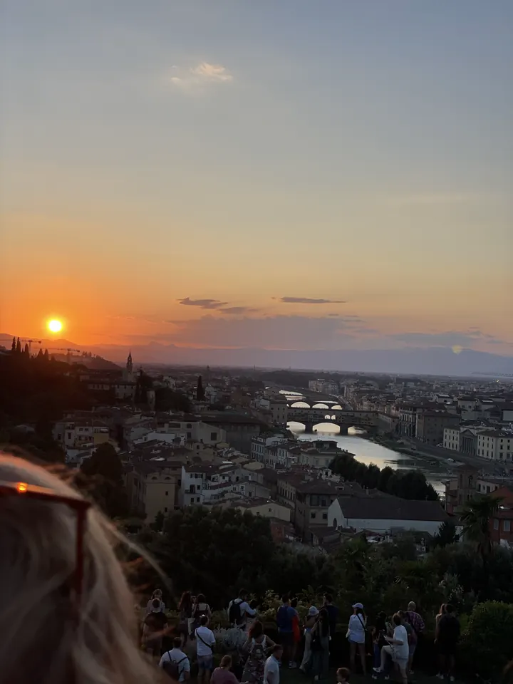 The sun setting over Florence's rooftops and hills