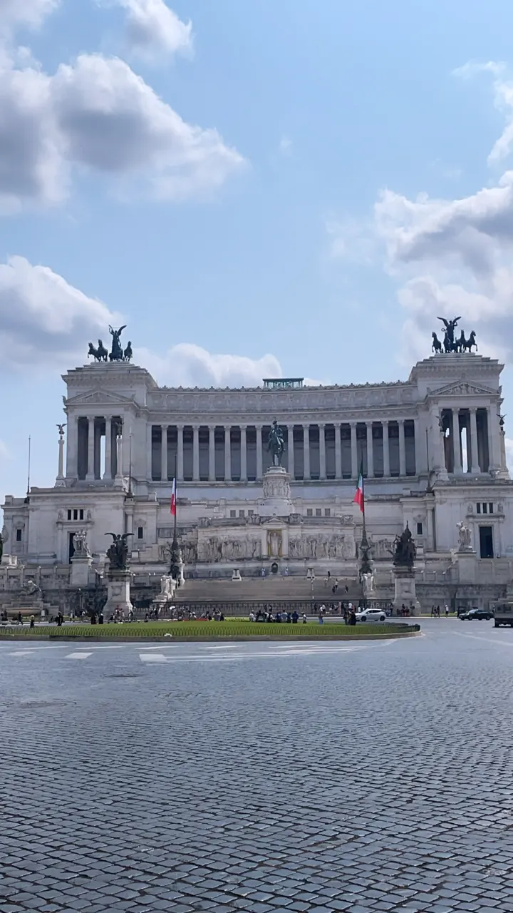 The white marble Vittoriano monument under a blue sky