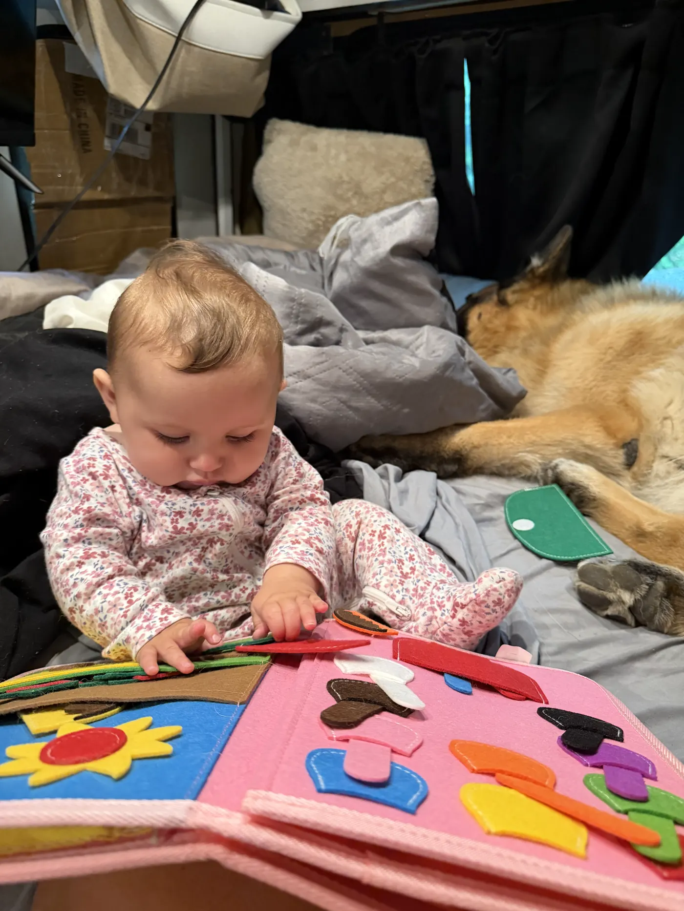 Baby Andi on her play mat inside the van