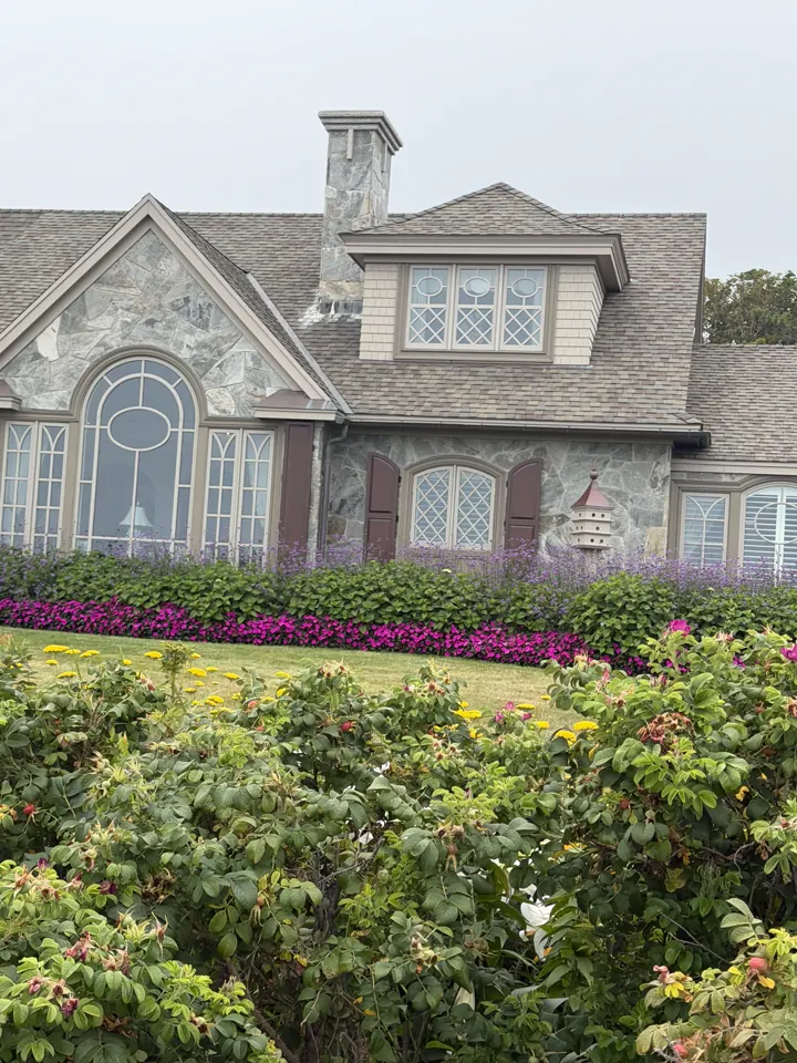 A seaside house wrapped in pink roses in Ogunquit, Maine
