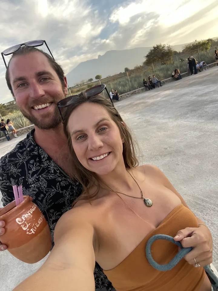 Colin and Angela taking a selfie holding drinks in Amatitán