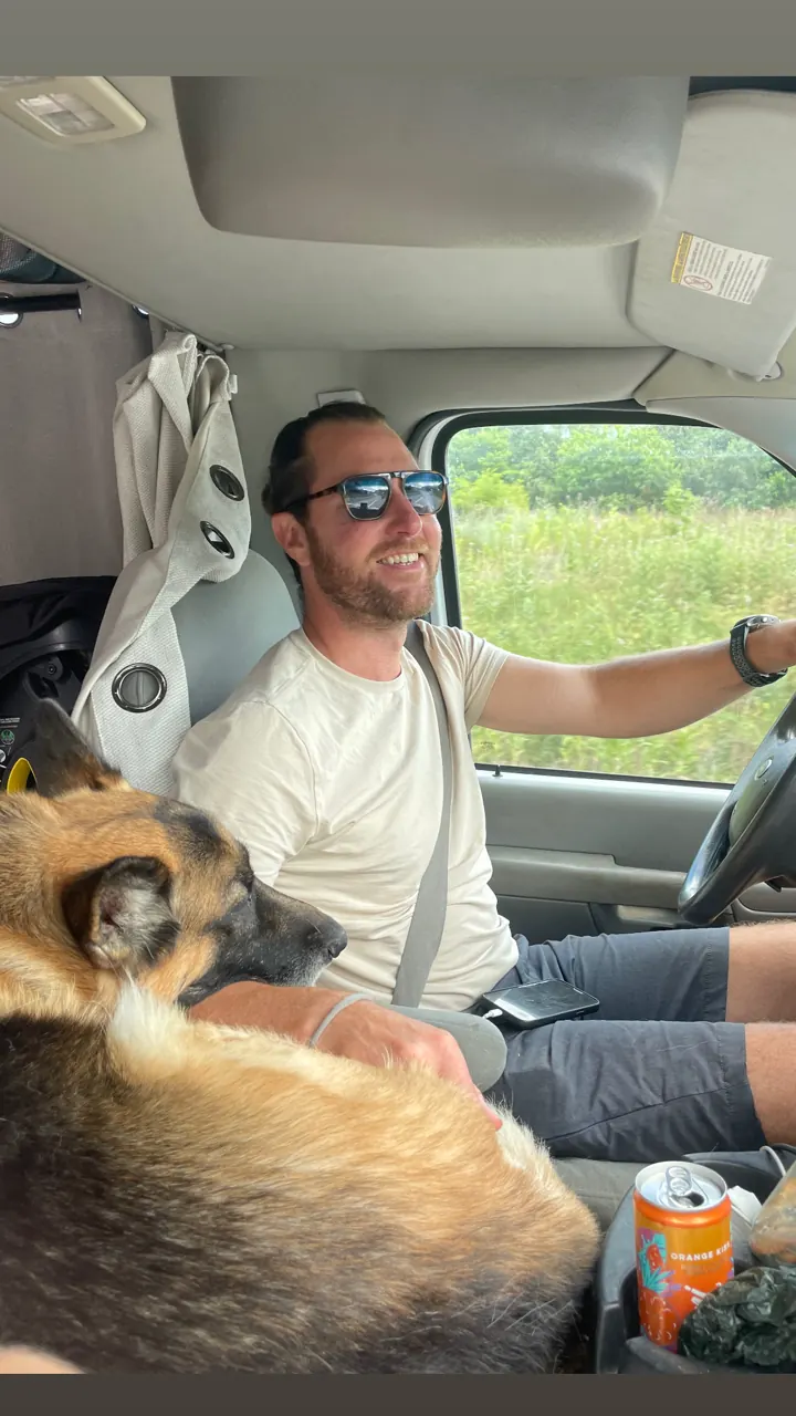 Jack riding in the van's front seat while Colin drives