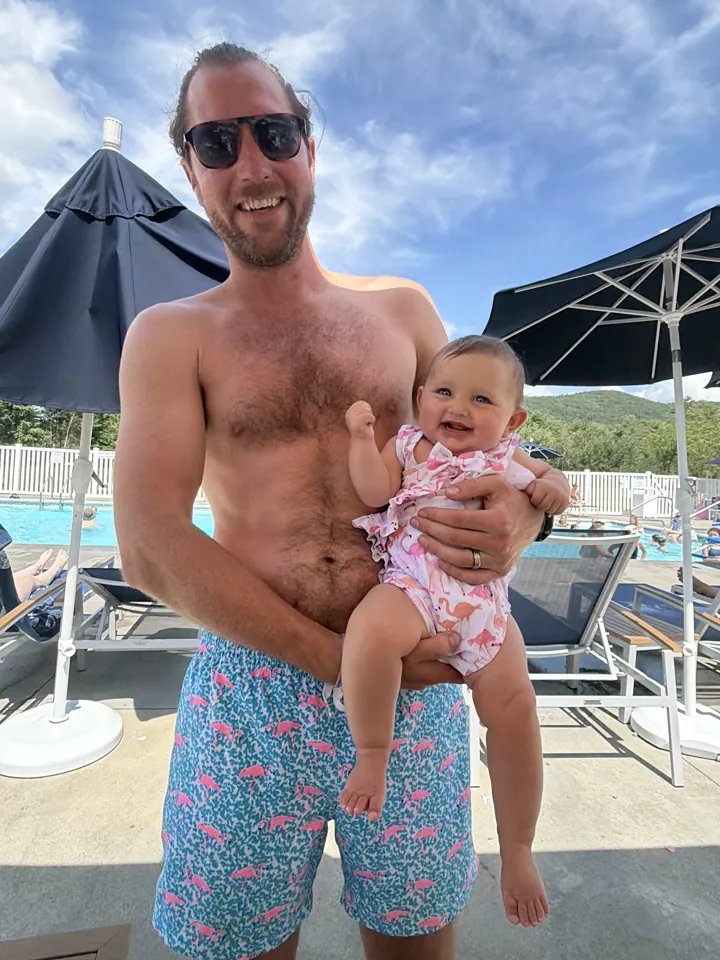 Colin holding Andi by the pool at Lake George