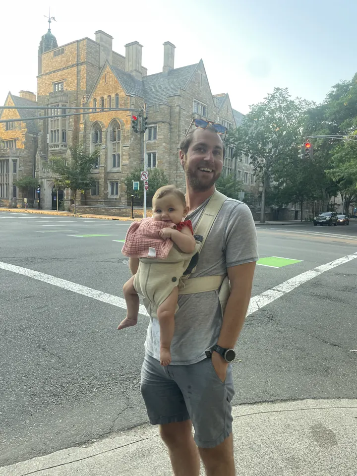 Colin carrying Andi past a Yale building in New Haven