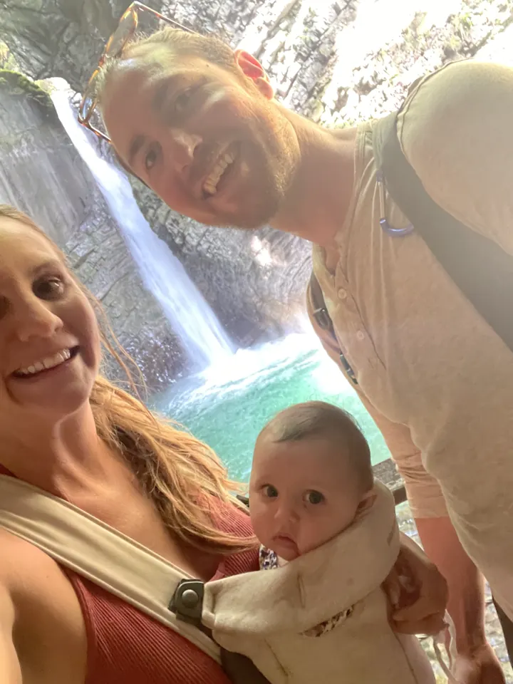 Angela and Andi in front of a waterfall near Kobarid