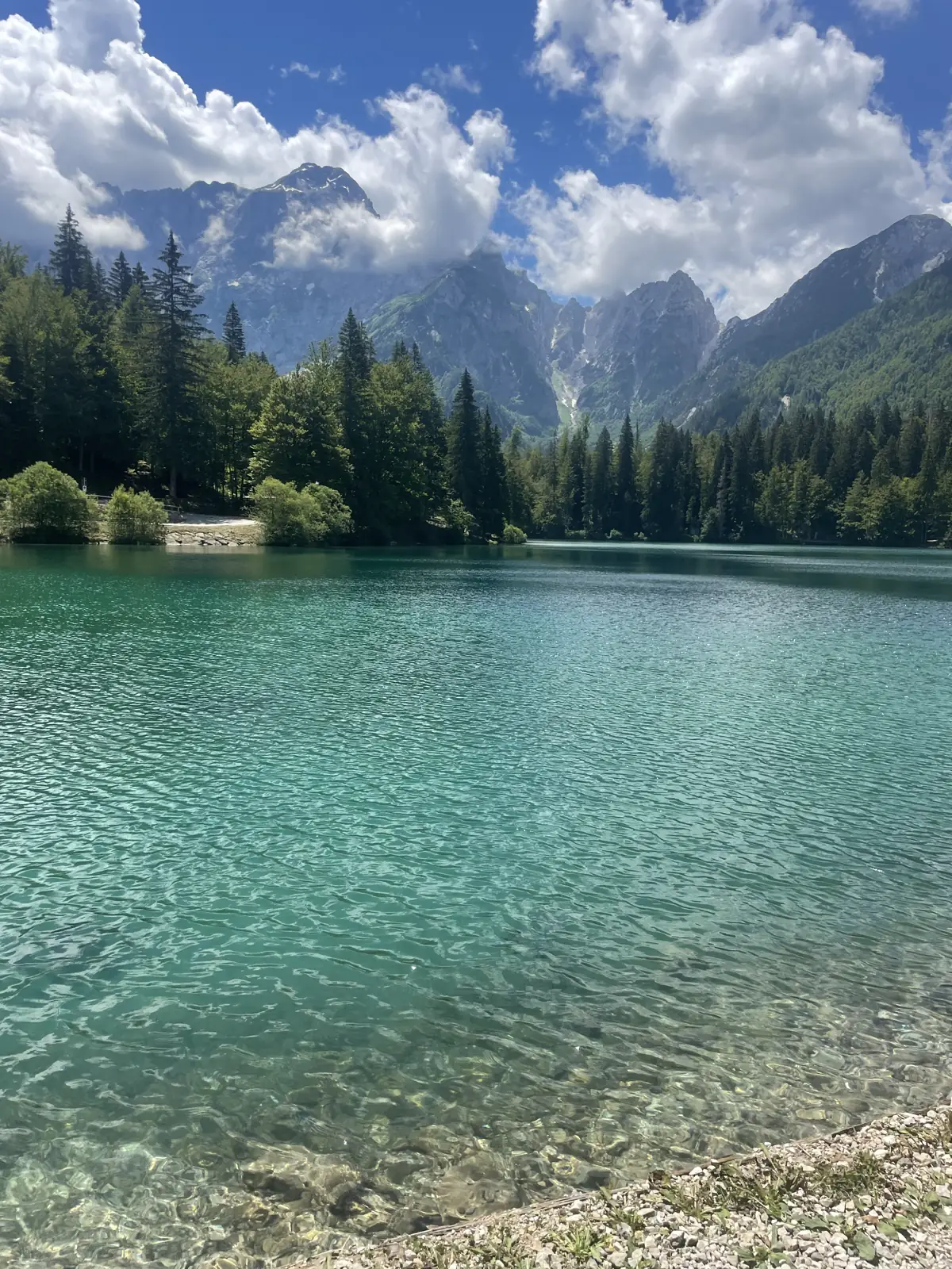 The clear turquoise water of Lago di Fusine in Italy