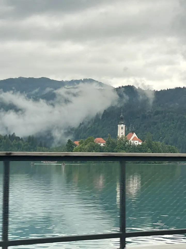 Lake Bled's island church in morning mist
