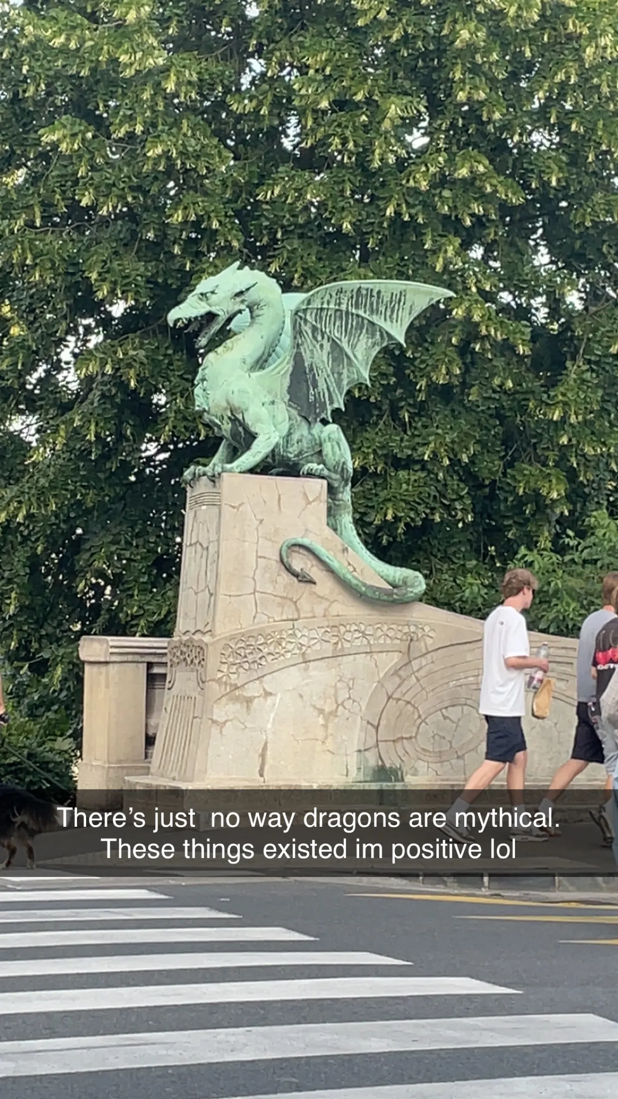 A dragon statue on the Dragon Bridge in Ljubljana