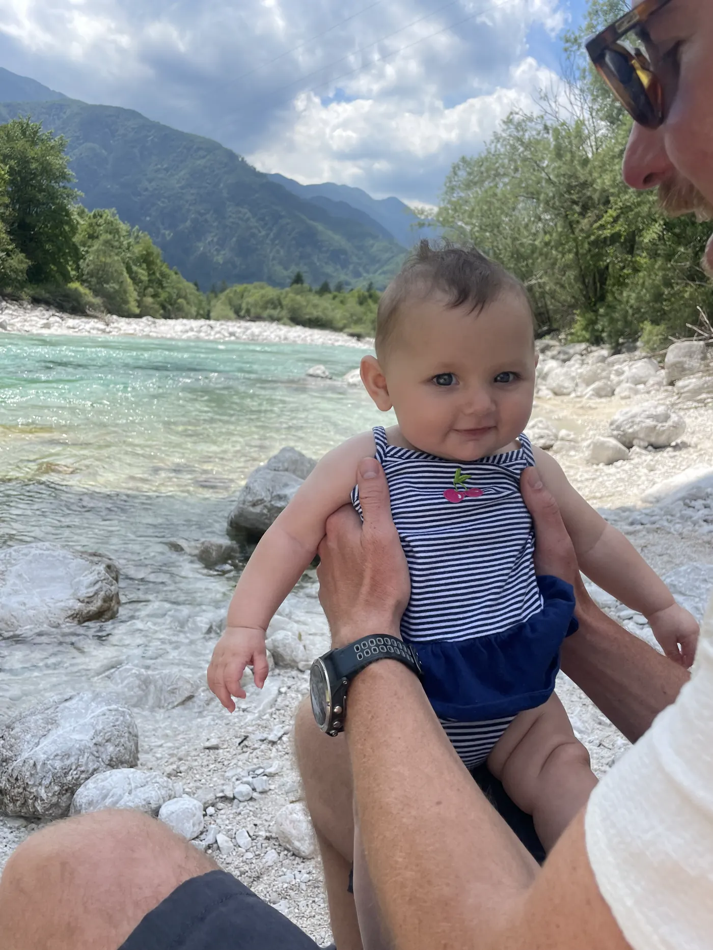 Andi held up over the turquoise Soča River