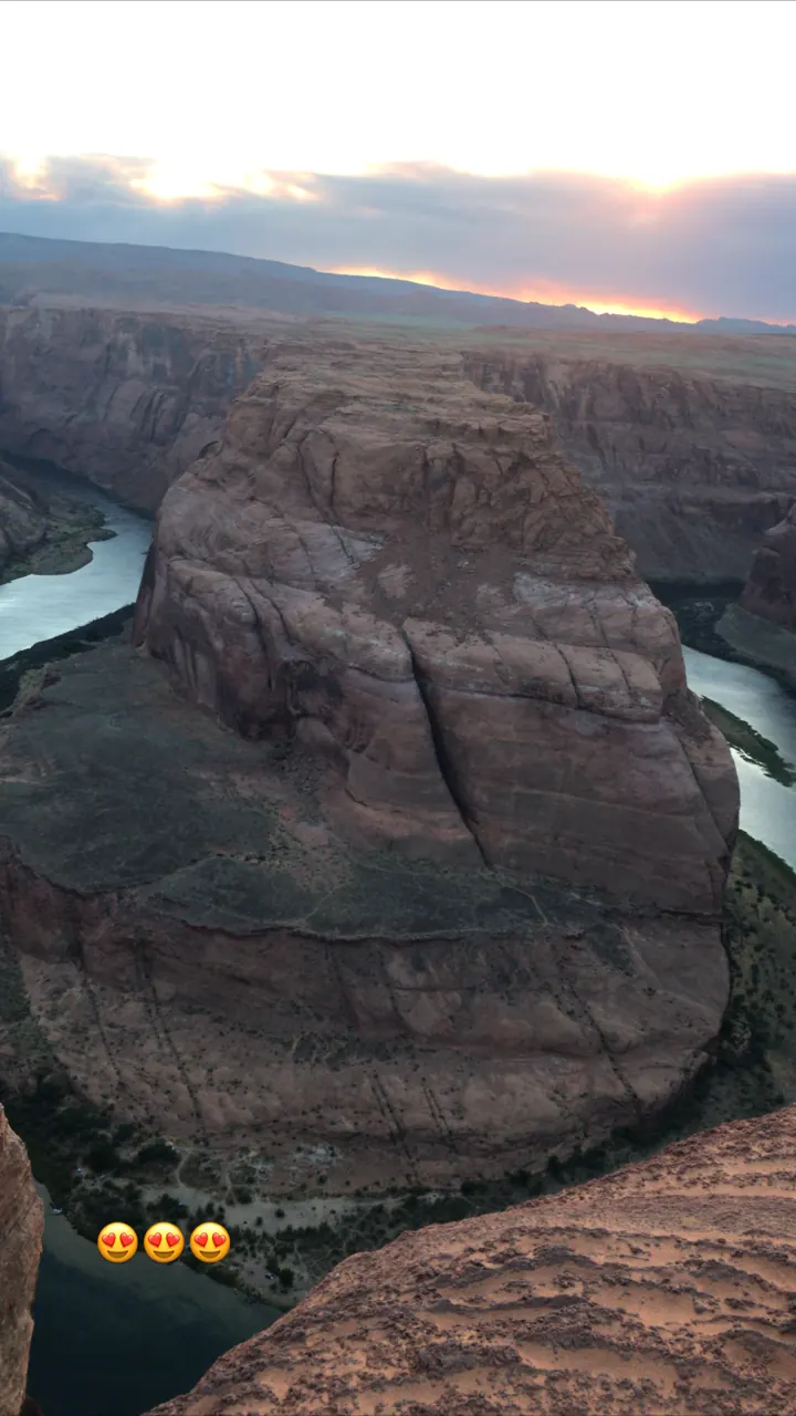 The Colorado River curving around Horseshoe Bend far below the canyon rim